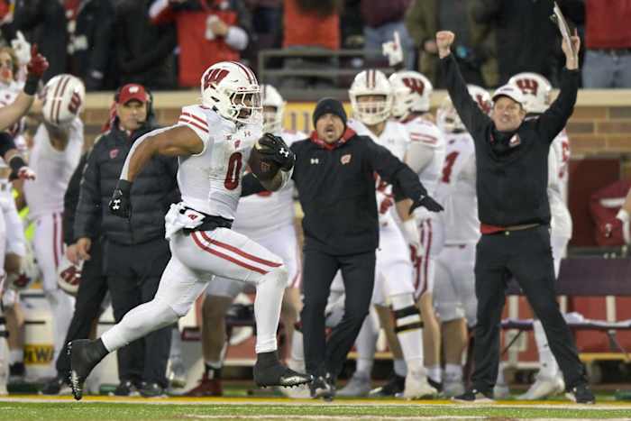 Nov 25, 2023; Minneapolis, Minnesota, USA; Wisconsin Badgers running back Braelon Allen (0) runs for 50-yards against the Minnesota Golden Gophers during the third quarter at Huntington Bank Stadium. Mandatory Credit: Nick Wosika-USA TODAY Sports